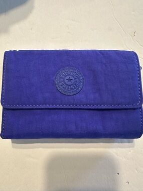 Kipling like new, retired striking purple wallet.